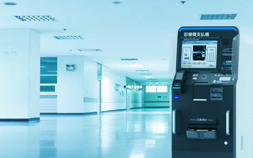 大規模病院の会計フロアに並ぶ自動精算機のイメージ